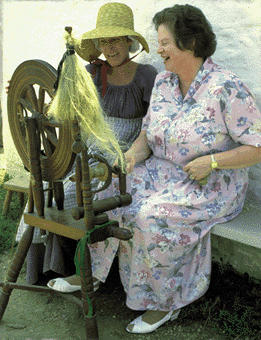 blind woman spinning flax